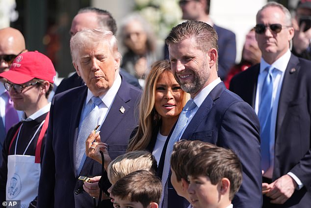 Eric Trump (center right) spoke to reporters Monday at the White House Easter Egg Roll about the future Trump presidential library, telling the Daily Mail that there would indeed be a replica of the White House ballroom in the Miami skyscraper that's being planned