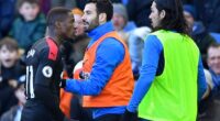 Wilfried Zaha confronts Ezequiel Schelotto (right) during a heated clash in 2020