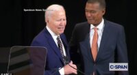 Former President Joe Biden (left) called Jeff Scruggs (right), the chairman of Syracuse University's Board of Trustees to his side on Tuesday during a portrait unveiling ceremony to tell him he looked like 'Barack'