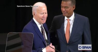 Former President Joe Biden (left) called Jeff Scruggs (right), the chairman of Syracuse University's Board of Trustees to his side on Tuesday during a portrait unveiling ceremony to tell him he looked like 'Barack'