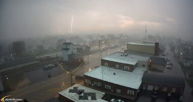 Millions of people in the Midwest were placed under extreme weather warnings Friday night (Pictured: A tornado and a severe thunderstorm rolled through Lena, Illinois, on Friday afternoon)