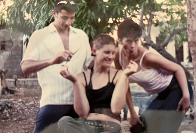 Nerida Mills (centre) was 19 years old and travelling the world when her hair started to fall out