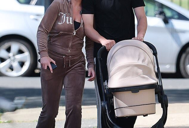 Freddy Brazier was every inch the doting dad as he and girlfriend Holly Swinburn stepped out for the first time with baby daughter Isla Jade in Essex this week