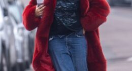 Giggling Raye suffered a wardrobe malfunction as she struggled to hang onto her unbuttoned jeans while rushing to film a new music video in Shepherd's Bush on Thursday