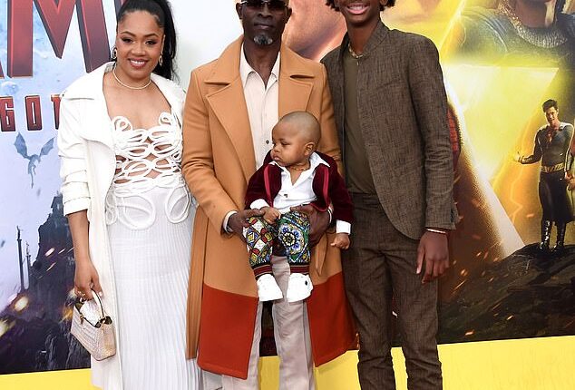 Djimon Hounsou's ex Riza Simpson (L) was arrested last week after the 61-year-old Gladiator star alleged to police that she struck him in the face with a closed fist at their Atlanta townhouse in December, according to documents obtained by TMZ; Simpson and Hounsou are pictured with family in March 2023 in LA