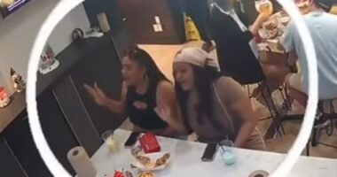 Two female customers were seen jamming out to music at Tasty Tails seafood restaurant in Dallas, Texas, before they darted for the door without paying their bill on Sunday evening