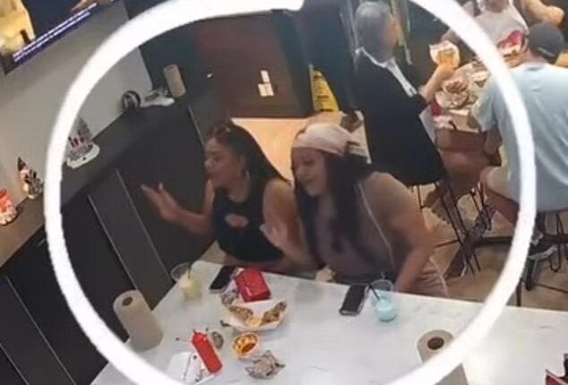 Two female customers were seen jamming out to music at Tasty Tails seafood restaurant in Dallas, Texas, before they darted for the door without paying their bill on Sunday evening