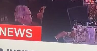 As others cowered under the tables at the White House Correspondents' Dinner, one man was seen calmly picking at his food