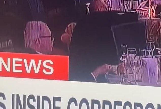As others cowered under the tables at the White House Correspondents' Dinner, one man was seen calmly picking at his food