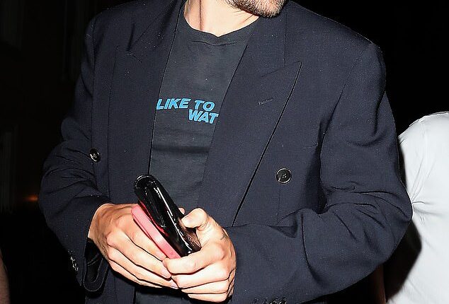 Harry Styles, 30, wore a voyeuristic graphic T-shirt for his low-key outing on Thursday night as he stepped out in Soho, London for dinner