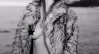 Heidi Klum was seen in a new eye-popping post to Instagram on Thursday. The 50-year-old  was seen in an open fur coat which flashed her bare breast and displayed her black bikini bottoms. The German pinup added a black star to one of her nipples to protect her modesty