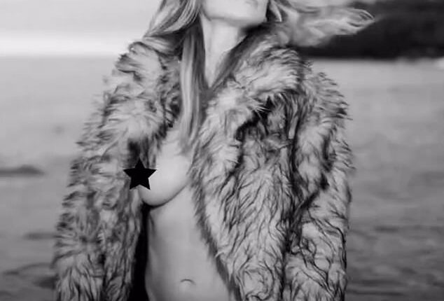 Heidi Klum was seen in a new eye-popping post to Instagram on Thursday. The 50-year-old  was seen in an open fur coat which flashed her bare breast and displayed her black bikini bottoms. The German pinup added a black star to one of her nipples to protect her modesty