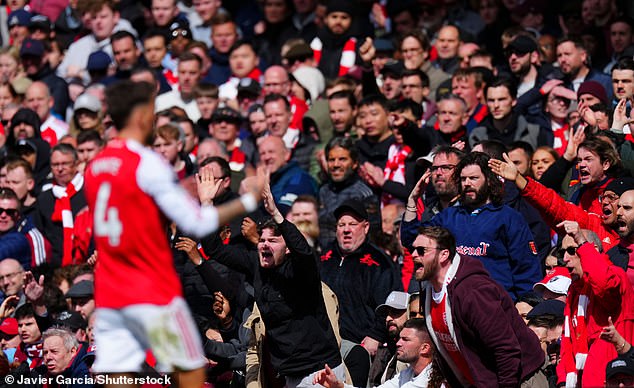 The Arsenal fans show their frustration during their side's crucial loss to Bournemouth