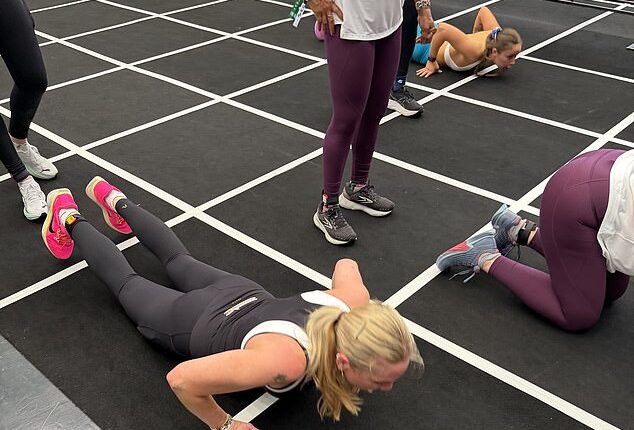 Rosie Nixon does her workout against the clock, surrounded by some of the fittest people you’ve ever seen – the kind who were born doing planks