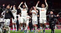 Leeds players celebrate their victory at arch-rivals Manchester United on Monday that was considerably more comfortable than the 2-1 scoreline suggests