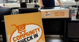 IGA Allambie Heights is trialling a Community Check-In lane, encouraging shoppers to slow down and share a conversation with staff like 'Chief Chatty Officer (CCO)' Layne Berry (pictured)