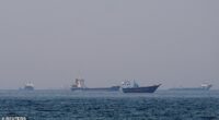 FILE PHOTO: Ships and boats in the Strait of Hormuz off the coast of Musandam, Oman, April 20, 2026. REUTERS/File Photo