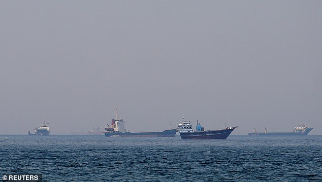 FILE PHOTO: Ships and boats in the Strait of Hormuz off the coast of Musandam, Oman, April 20, 2026. REUTERS/File Photo
