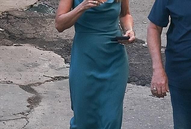 Jennifer Aniston donned a glamorous teal-blue gown with black flip-flop sandals while filming season five of her Apple TV+ series The Morning Show in Los Angeles , California on Tuesday
