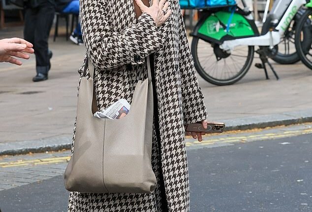 Kate Garraway couldn't keep the smile off her face as she left Smooth Radio on Tuesday after growing close to broadcaster Liam Halligan, two years after the death of her husband