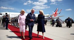 King Charles III and Britain's Queen Camilla are greeted by US Protocol Chief Monica Crowley as they arrive at Joint Base Andrews