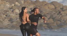 Kim Kardashian was seen making out with Lewis Hamilton for the first time as they were spotted at a beach in Malibu on Tuesday
