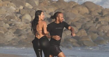 Kim Kardashian was seen making out with Lewis Hamilton for the first time as they were spotted at a beach in Malibu on Tuesday