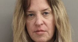 Lindsay Lohan ’s stepmother Kate Major appeared dishevelled and downcast in a newly released mugshot following her arrest over an alleged altercation with estranged husband Michael Lohan