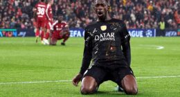 Ousmane Dembele celebrates scoring the first goal of the game for PSG against Liverpool