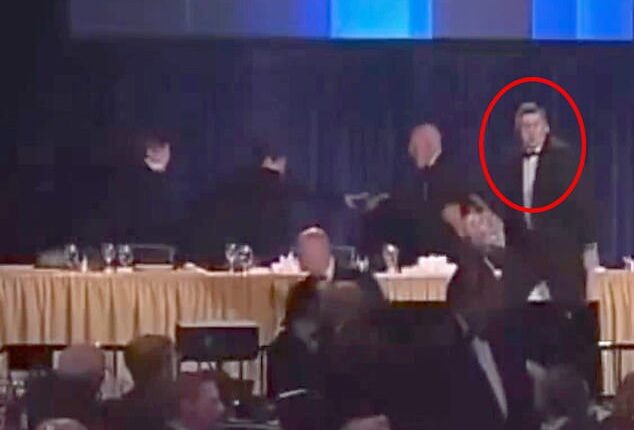 As the first pops of gunfire echoed through the subterranean lobby of the Washington Hilton, the man did not duck; instead, he lunged toward President Trump, using his own body as a human shield to block the Commander-in-Chief from potential fire