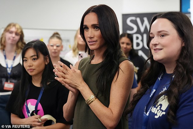 Meghan tells fans she was bullied online 'every day for 10 years' and became 'most trolled person in the world' as Prince Harry suffers awkward selfie moment with Australian TV reporter