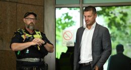 Justin McKeone (right) leaves the Melbourne Magistrates' Court on Friday