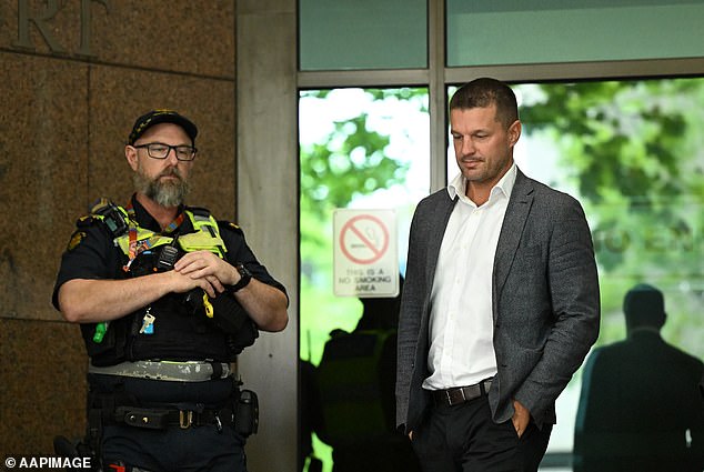 Justin McKeone (right) leaves the Melbourne Magistrates' Court on Friday