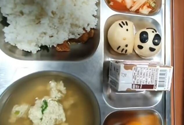 Social media videos show young students in the East Asian nation loading their metal trays up with freshly cooked curries