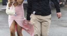 Glamorous racegoers at The Coral Scottish Grand National in Ayrshire, Scotland, were hit with rainy weather