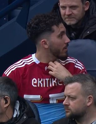 Cherki dons Ekitike's shirt on the subs' bench