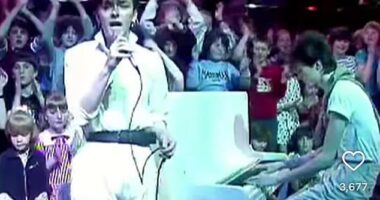 Ricky Gervais looked unrecognisable in a belted white jumpsuit in a throwback snap from his 1980s pop career