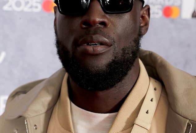 Stormzy hid behind sunglasses as he attended the star-studded 2025 BRIT Awards at London¿s O2 Arena on Saturday
