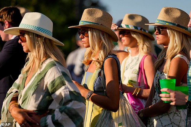Patrons watch on the 17th hole during the third round of the Masters golf tournament at the Augusta National Golf Club, Saturday, April 11