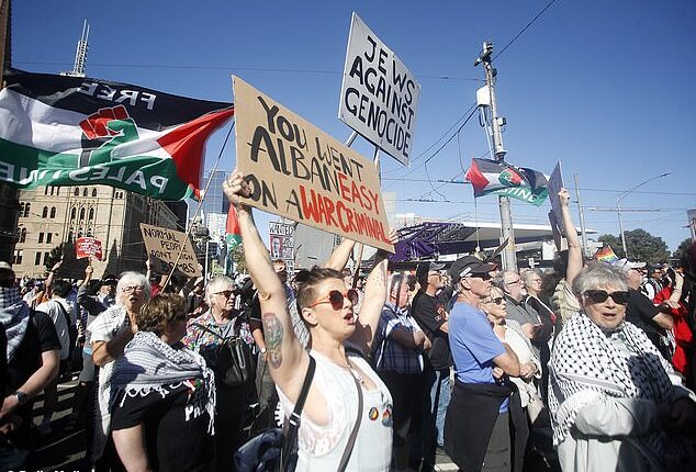 Protesters flocked to Flinders St Station to protest against Israeli president Isaac Herzog's visit Down Under. (It is not suggested anyone pictured was a paid protester)