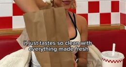 It was once the trendiest dining out option available - but now burger joints are slowly fading for Britain's streets (pictured: Influencer Gabby Allen at Five Guys)