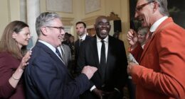 ArsenalFanTV founder Robbie Lyle (centre) at 10 Downing Street with Prime Minister Sir Keir Starmer and Gunners legend Tony Adams