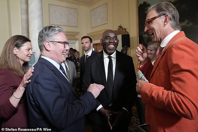 ArsenalFanTV founder Robbie Lyle (centre) at 10 Downing Street with Prime Minister Sir Keir Starmer and Gunners legend Tony Adams