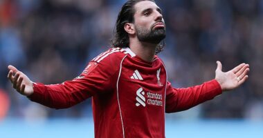 Dominik Szoboszlai goes over to the away fans after the heavy defeat at the Etihad