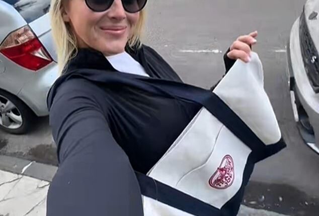 Forget designer bags, now shoppers are raving about supermarket totes, including content creator Jessica Abbassian (pictured), who carried a Trader Joe's bag back from America