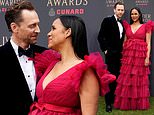 Tom Hiddleston gazes adoringly at fiancée Zawe Ashton as couple put on a loved-up display at the Olivier Awards after welcoming their second child