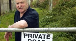 Tony Martin is pictured outside his farmhouse called Bleak House in near Wisbech, Norfolk, shortly after his release from prison in August 2003