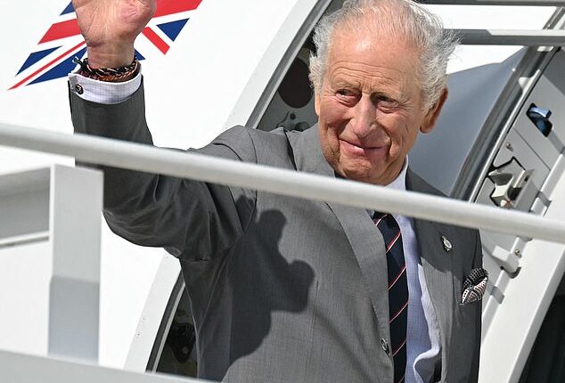 Charles waves goodbye as he boards his plane at Joint Base Andrews in Maryland