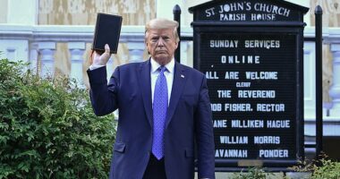 President Donald Trump stands outside St. John's Church in a controversial photo-op in which he held the Bible upside-down amid the 2020 Black Lives Matter protests. On Tuesday night, he'll read a verse from the Bible to mark the country's 250th birthday