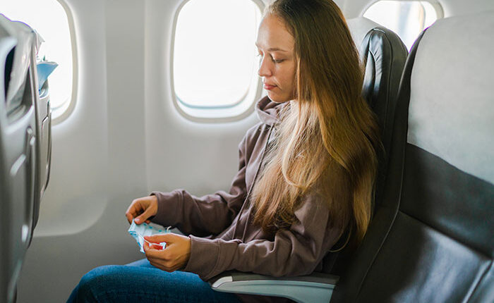 Woman Refuses To Move Her Hair On Plane, Dad Figures Out How To Make Her Super Uncomfortable